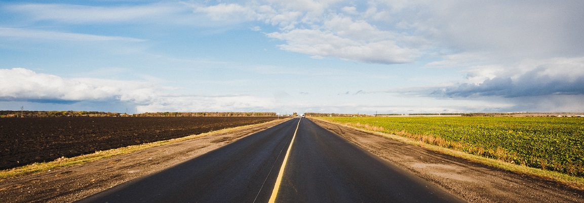 Image of a road with fields both sides