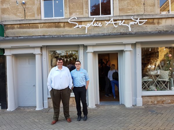 Two people standing out the front of sophie allport store front