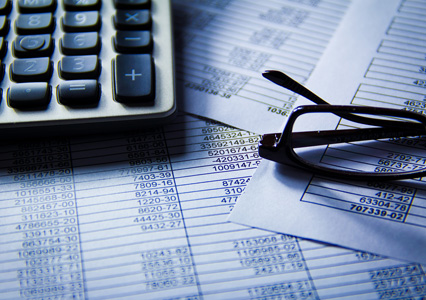 Calculator, paper and glasses