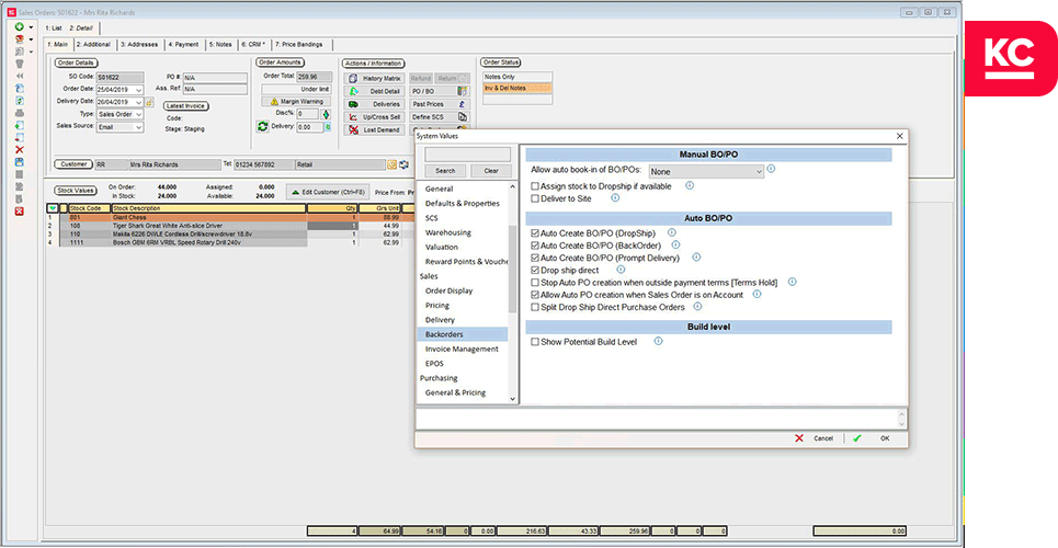 A screenshot of the sales order screen in Khaos Control with the system values popup over it showing the options for backordering