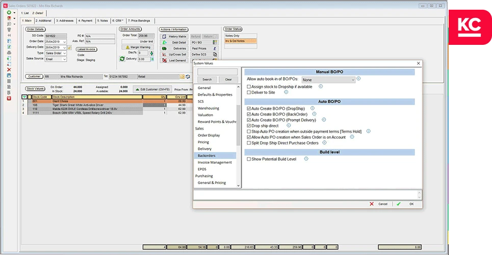 A screenshot of the sales order screen in Khaos Control with the system values popup over it showing the options for backordering
