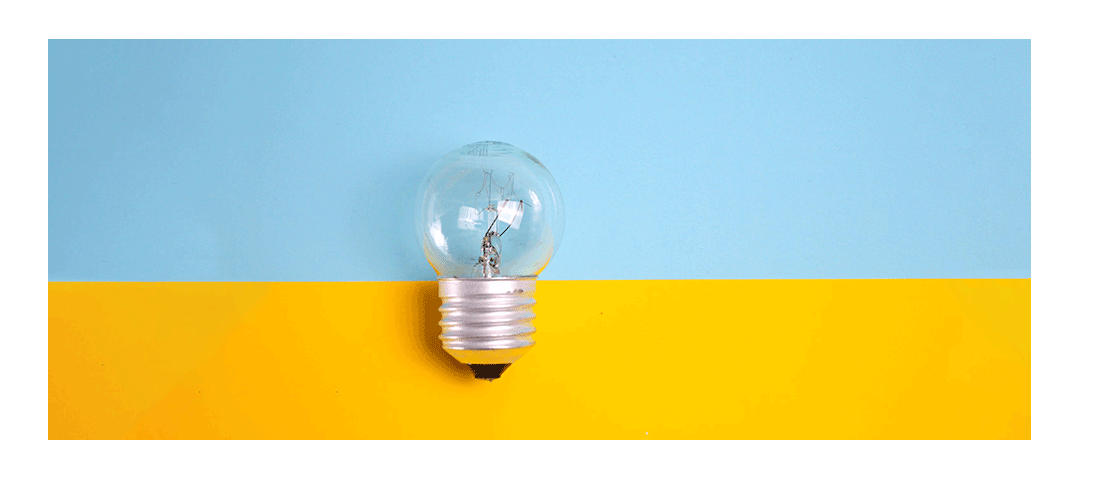 A small lightbulb in front of a blue and yellow background