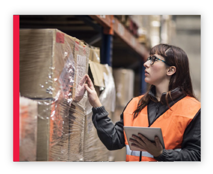 Warehouse employee checking a products stock label.