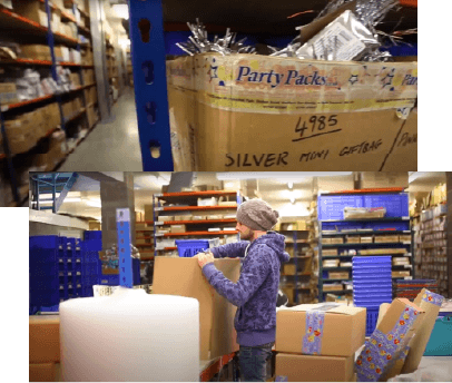 Warehouse picking at Party Packs with boxes being moved from one stage to another