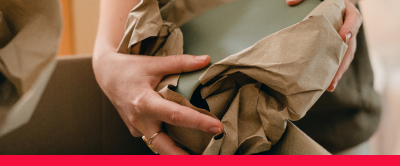 Hands unwrapping a plate