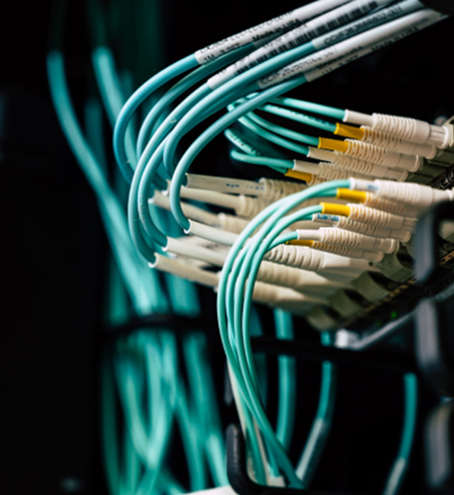 Lots of cables going into the back of a server