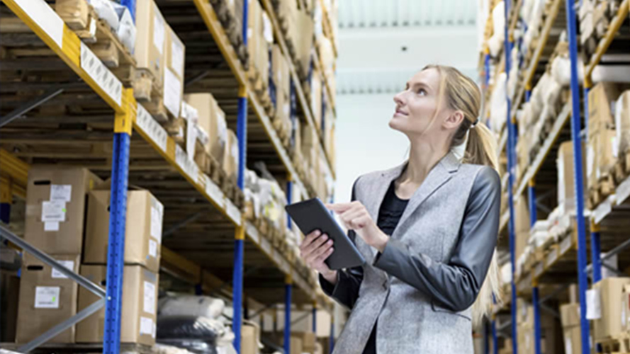 Person taking a stock check through software on a handheld device.