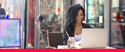 person at a cafe on a laptop